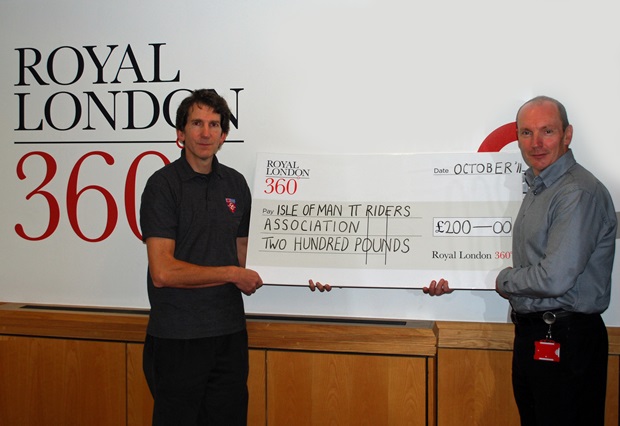 Mike Crellin (right), Finance and Commercial Director of Royal London 360°, presents a cheque for £200 to Andrew Jessopp, a Committee Member of the Isle of Man TT Riders Association